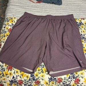 Purple Peloton shorts with built in stretchy bike shorts underneath